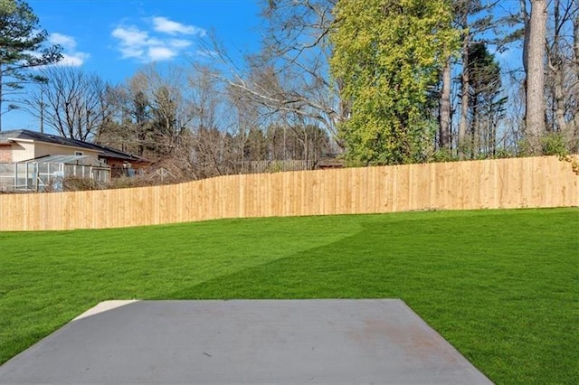 view of yard with a patio area and fence