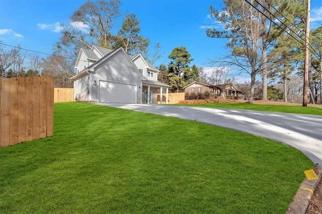 view of property exterior with a lawn, fence, and concrete driveway