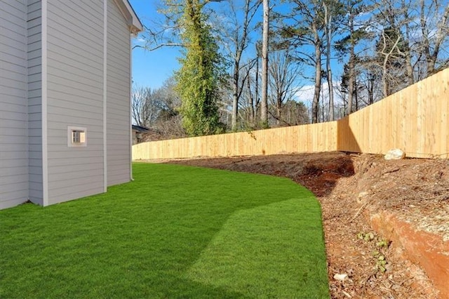 view of yard with a fenced backyard