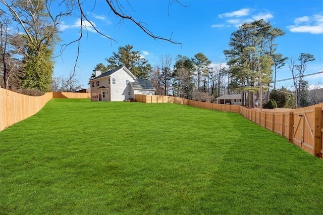 view of yard with a fenced backyard