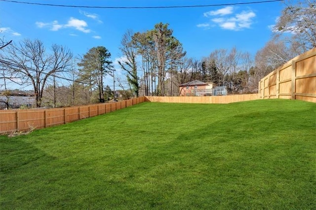 view of yard with a fenced backyard