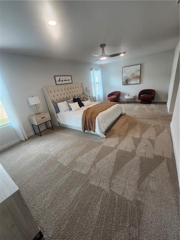 bedroom with baseboards, recessed lighting, carpet, and a ceiling fan