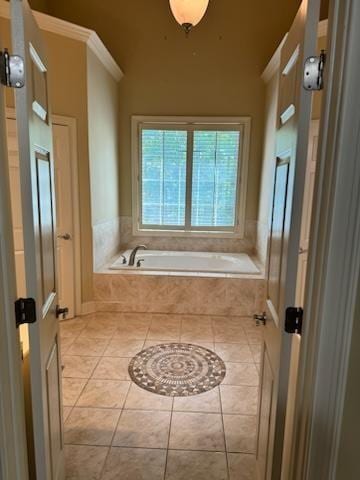 bathroom featuring tiled bath, tile patterned floors, and crown molding