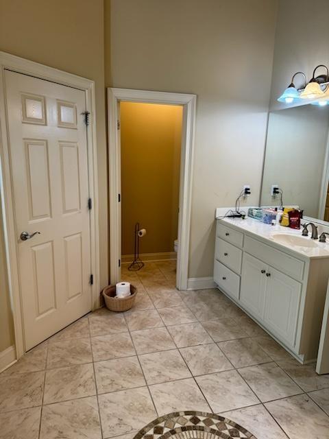 bathroom with tile patterned floors and vanity