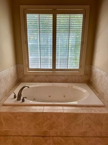 bathroom with tiled tub