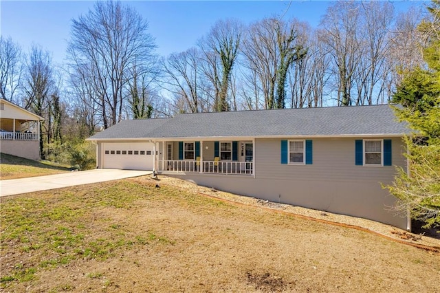 single story home with driveway, covered porch, a garage, and a front lawn