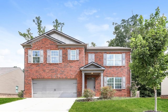 view of front of home featuring a front lawn and a garage