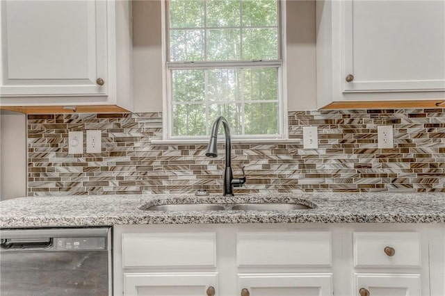 459 Bakers Bridge Cir, Douglasville, GA 30134 - kitchen with dishwasher, a sink, white cabinetry, and backsplash