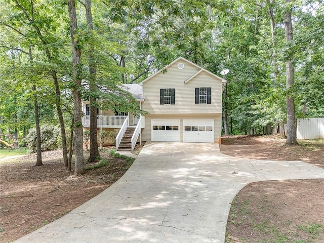 459 Bakers Bridge Cir, Douglasville, GA 30134 - view of front facade with stairs, a garage, and concrete driveway