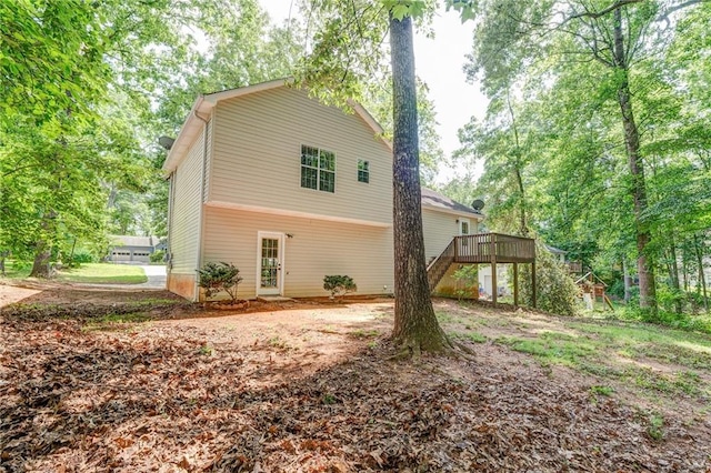 459 Bakers Bridge Cir, Douglasville, GA 30134 - view of side of home featuring stairs and a wooden deck