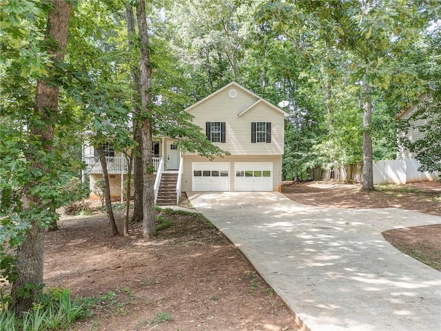 459 Bakers Bridge Cir, Douglasville, GA 30134 - view of front of house featuring stairway, concrete driveway, and an attached garage