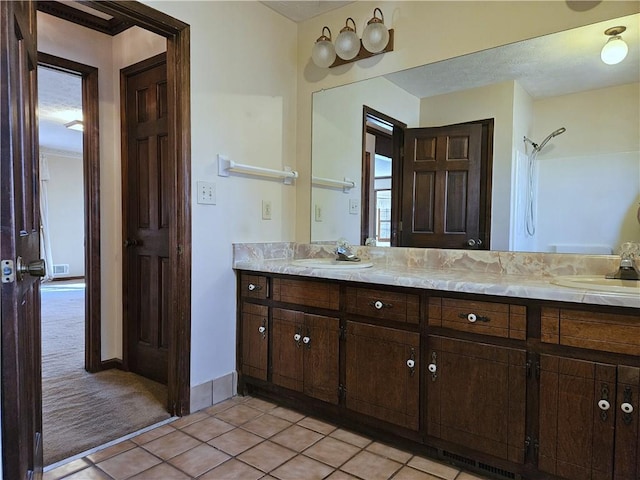 bathroom with vanity and tile patterned floors