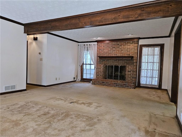 unfurnished living room with beamed ceiling, ornamental molding, and light carpet