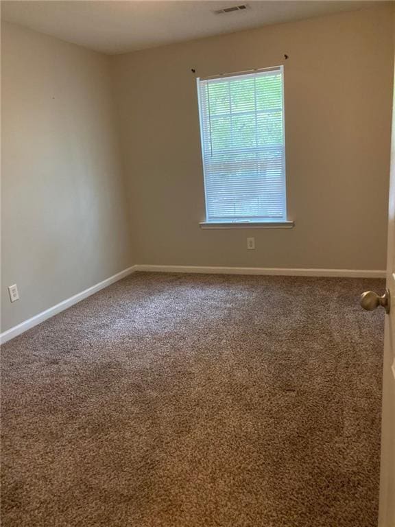 view of carpeted spare room