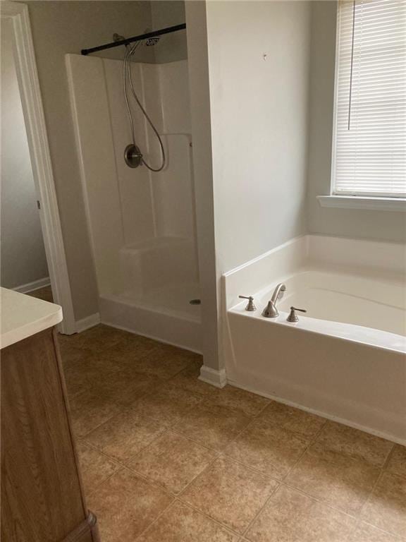 bathroom with vanity and independent shower and bath