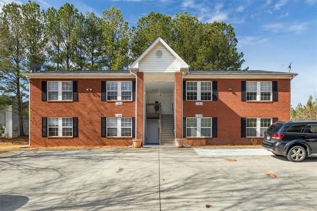 bi-level home featuring brick siding