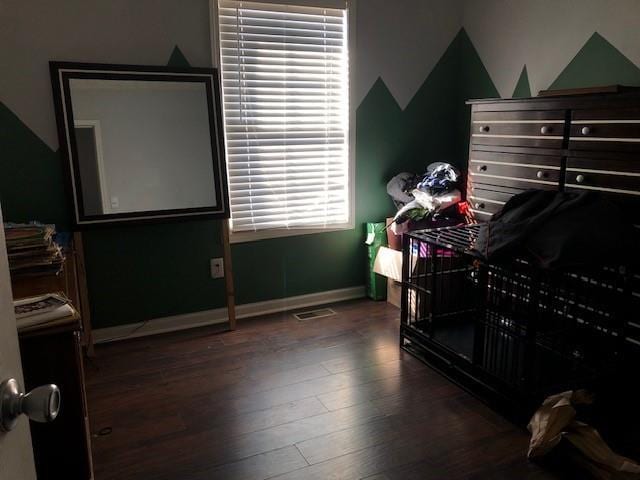 bedroom featuring dark wood-type flooring