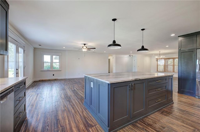 kitchen with light stone countertops, dark hardwood / wood-style flooring, dishwasher, a center island, and hanging light fixtures