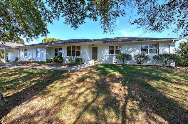 ranch-style home featuring a front yard