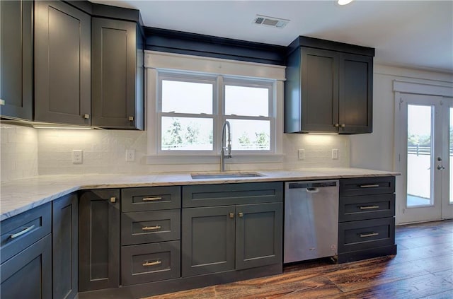 kitchen with dishwasher, dark hardwood / wood-style flooring, a healthy amount of sunlight, and sink