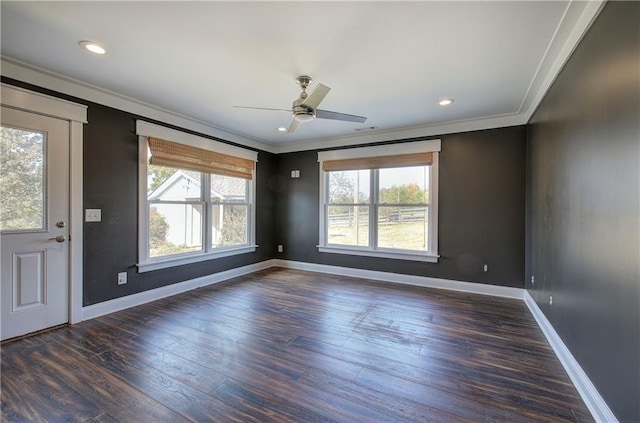 interior space with crown molding, ceiling fan, a healthy amount of sunlight, and dark hardwood / wood-style floors