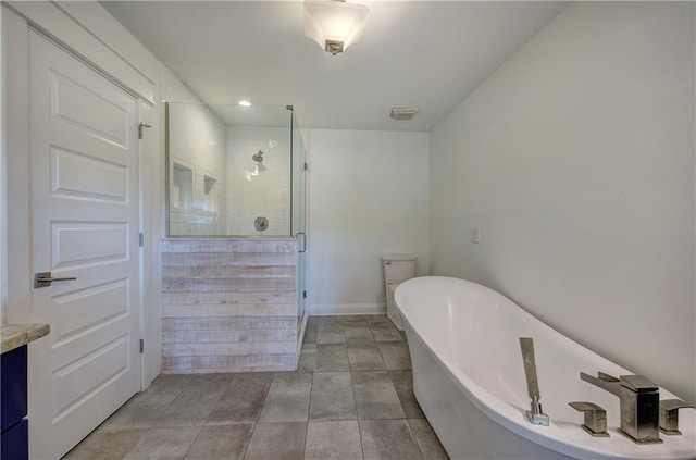 full bathroom with tile patterned floors, vanity, independent shower and bath, and toilet