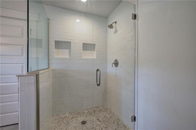 bathroom featuring an enclosed shower