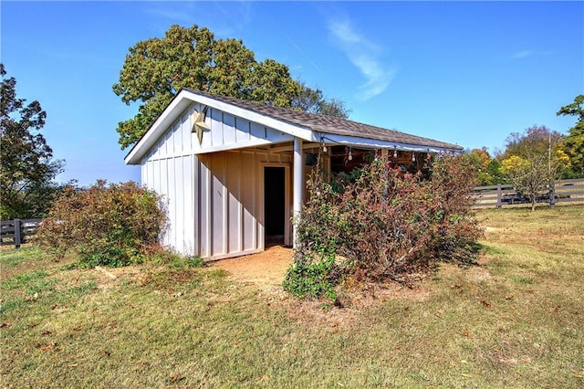 view of outbuilding featuring a yard