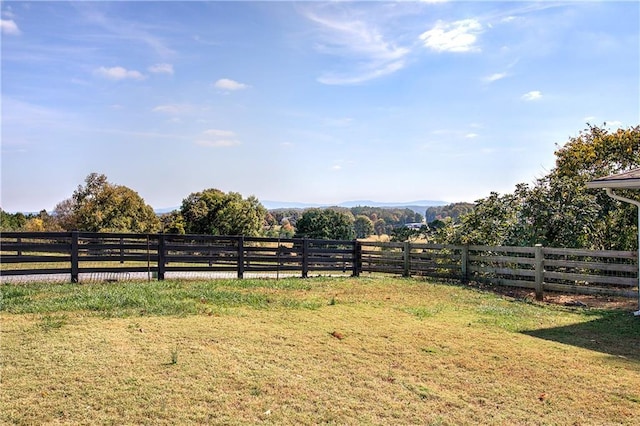 view of yard featuring a mountain view and a rural view