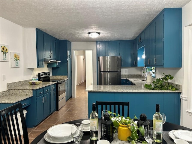 kitchen featuring appliances with stainless steel finishes, blue cabinets, and sink