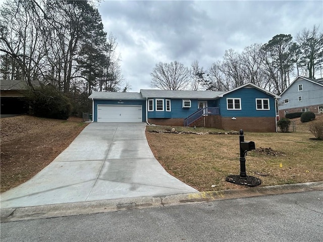 single story home featuring a garage and a front yard