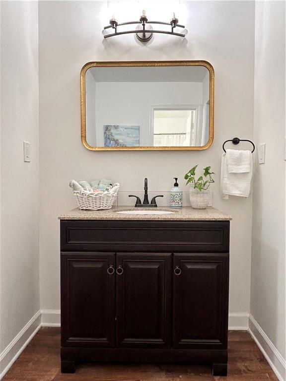 bathroom with vanity and hardwood / wood-style floors