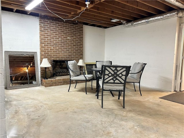 basement with a brick fireplace