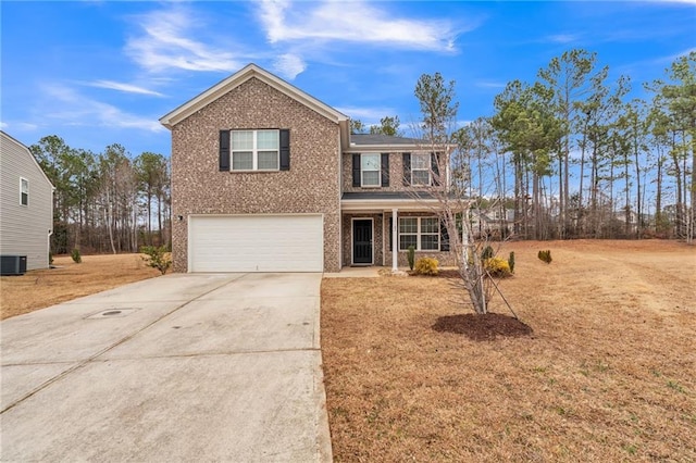 front of property with central AC, a garage, and a front yard