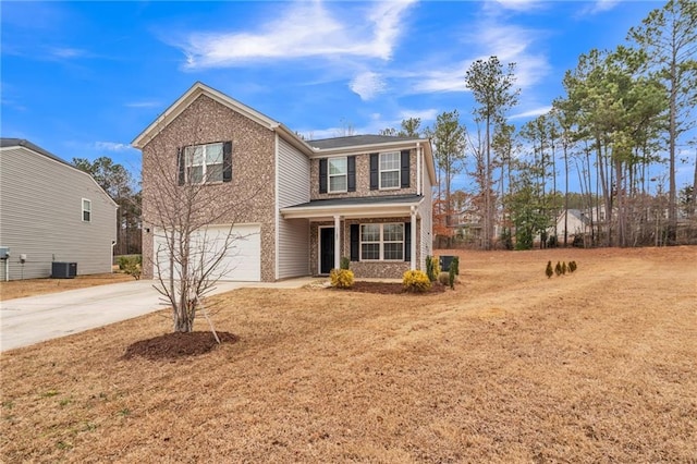 view of front of house with central AC unit and a garage