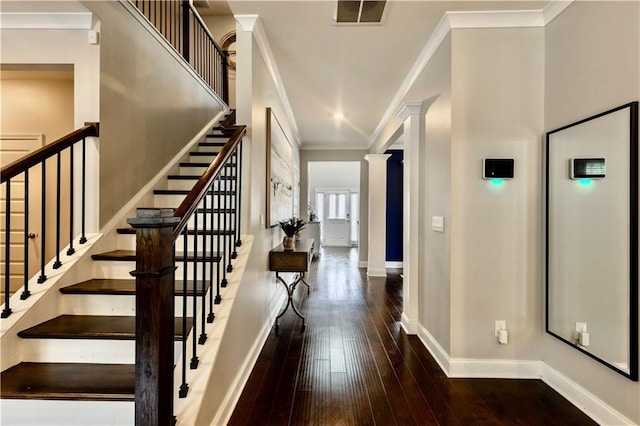 133 Canal St, Hampton, GA 30228 - stairs with baseboards, wood-type flooring, ornate columns, and crown molding