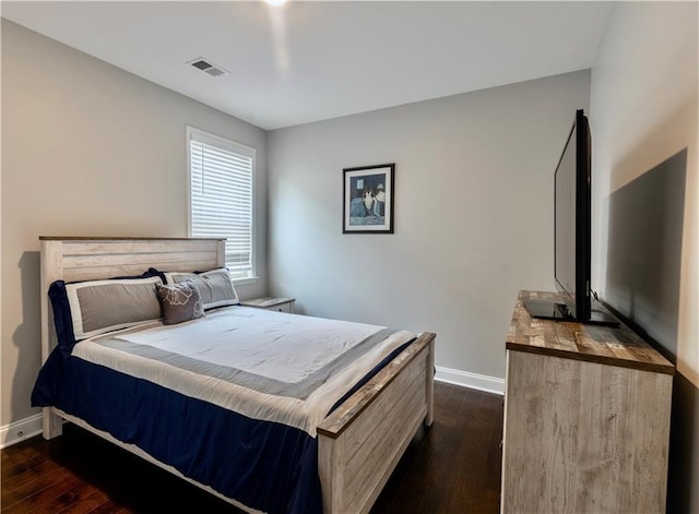 133 Canal St, Hampton, GA 30228 - bedroom with baseboards and dark wood-style floors