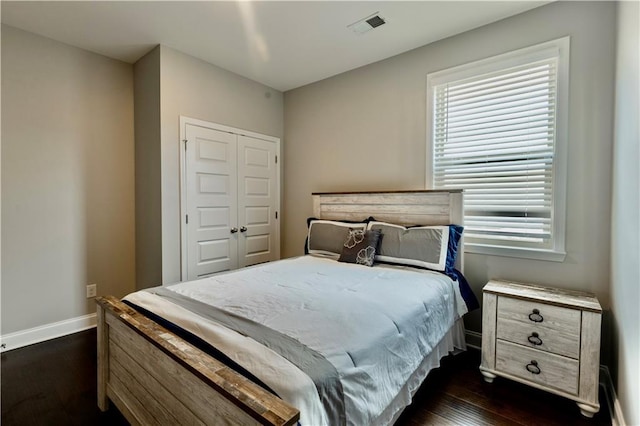 133 Canal St, Hampton, GA 30228 - bedroom featuring dark wood finished floors, baseboards, and a closet