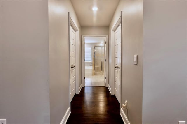 133 Canal St, Hampton, GA 30228 - corridor with dark wood finished floors, baseboards, and recessed lighting