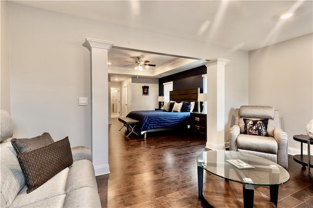 133 Canal St, Hampton, GA 30228 - bedroom with ornate columns, dark wood-style flooring, baseboards, a tray ceiling, and recessed lighting