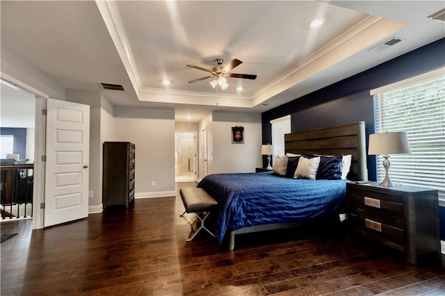 133 Canal St, Hampton, GA 30228 - bedroom featuring a tray ceiling, hardwood / wood-style flooring, crown molding, ensuite bath, and baseboards