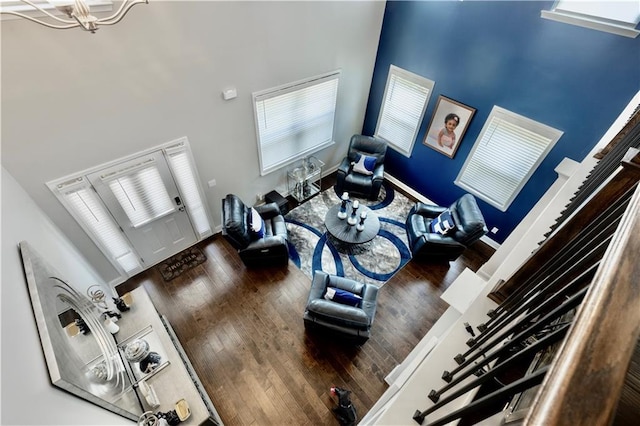 133 Canal St, Hampton, GA 30228 - living area featuring a towering ceiling, wood finished floors, and a chandelier