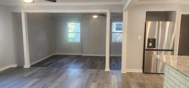 kitchen with ceiling fan, stainless steel fridge with ice dispenser, dark hardwood / wood-style flooring, light stone counters, and crown molding