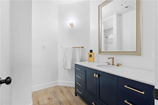 108 Vinings Forest Cir SE, Smyrna, GA 30080 - bathroom with wood finished floors, baseboards, and vanity