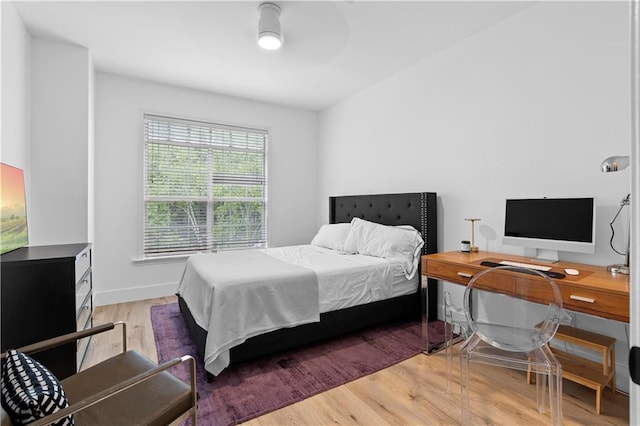 108 Vinings Forest Cir SE, Smyrna, GA 30080 - bedroom with wood finished floors, a desk, and baseboards