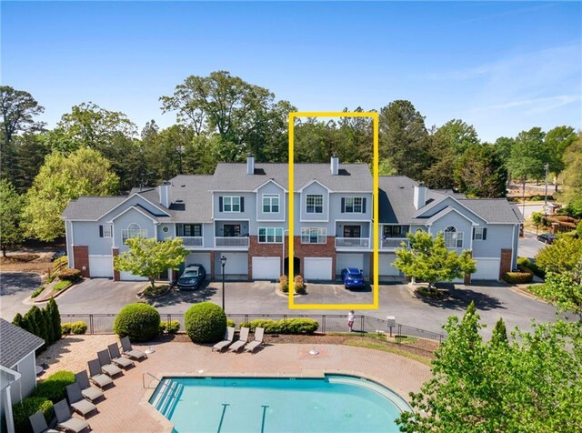 108 Vinings Forest Cir SE, Smyrna, GA 30080 - back of property featuring fence and a chimney