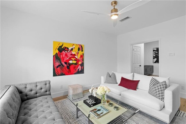 108 Vinings Forest Cir SE, Smyrna, GA 30080 - living room featuring wood finished floors, baseboards, and a ceiling fan