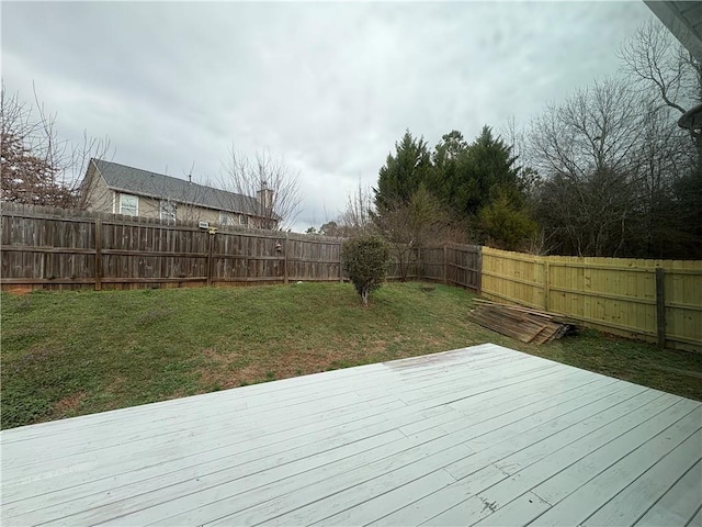 wooden deck with a yard