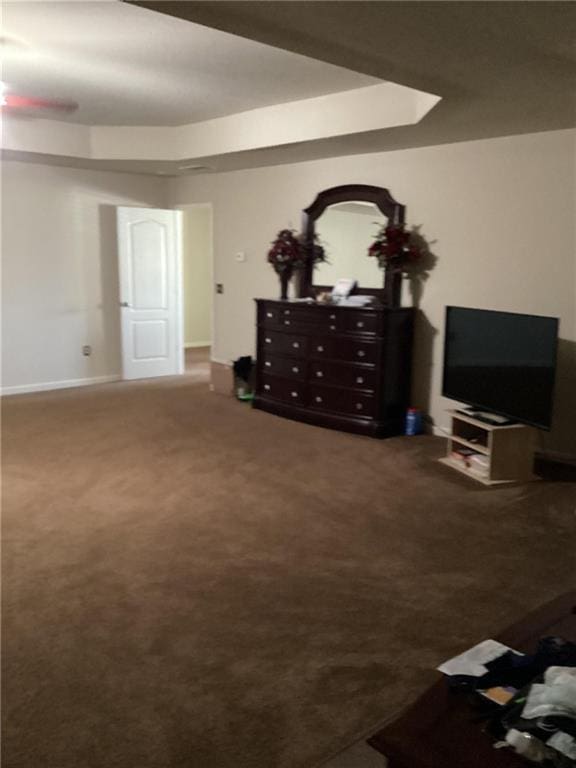 carpeted living room featuring baseboards