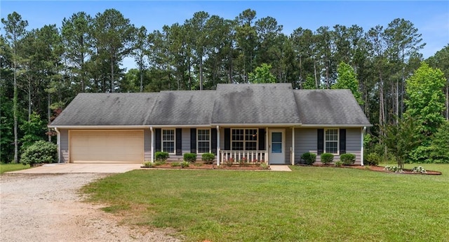 4841 Partee Trl, Social Circle, GA 30025 - view of front of property with driveway, covered porch, an attached garage, a front lawn, and view of scattered trees
